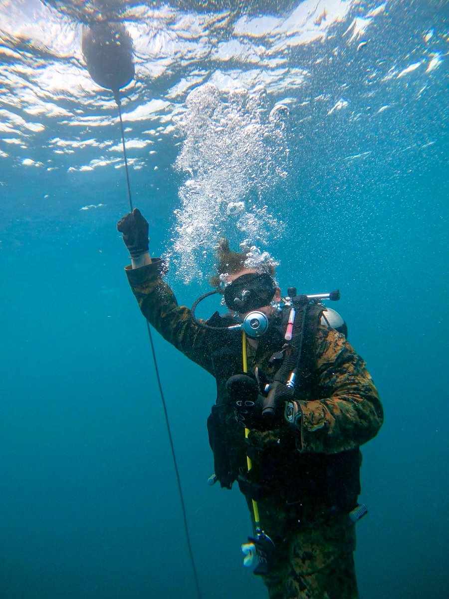 USMC's tweet image. #Marines with @3d_Marine_Div recover a weighted ammo can from the sea floor during a search and recovery dive drill on Camp Schwab, Okinawa, Japan.
This training is designed to enhance the Marines' proficiency and capabilities in specialized insertion and extraction operations.…