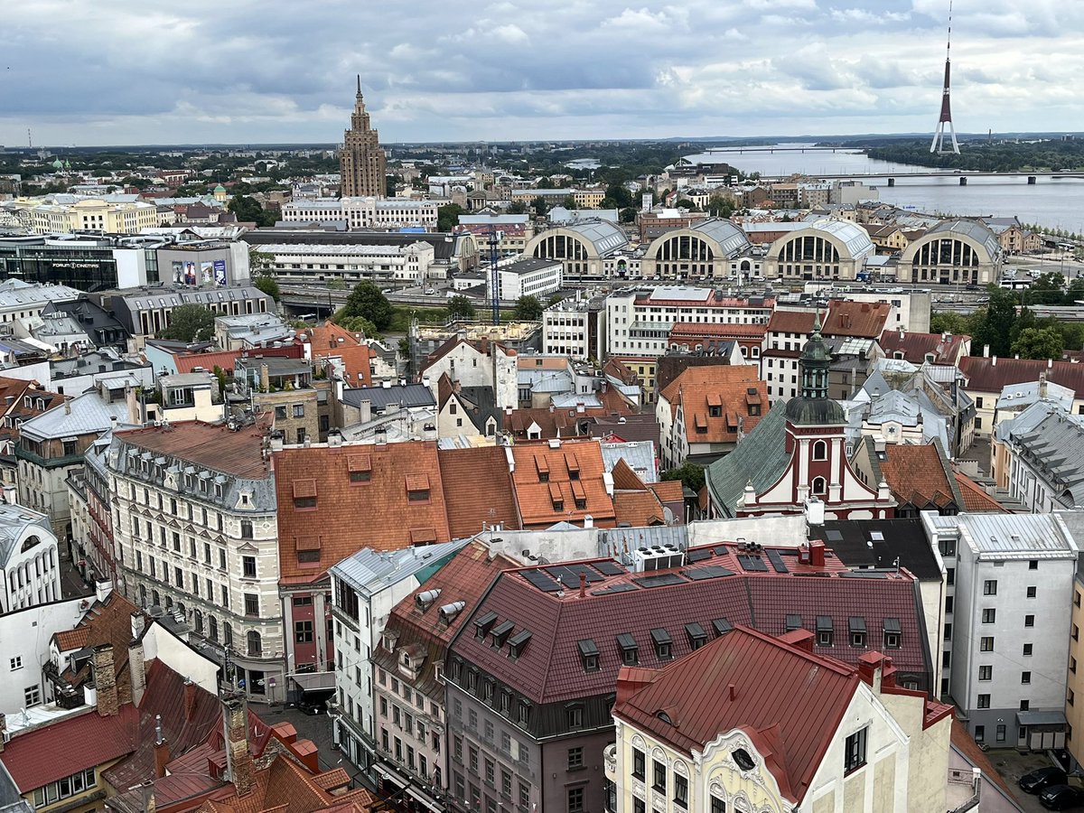 MicheleBerdy's tweet image. Your #morningcalm from Riga is a view from St Peter’s spire of former airplane hangers that are now the central market, the Soviet-built Academy of Sciences building and TV tower in the distance across the Daugava.