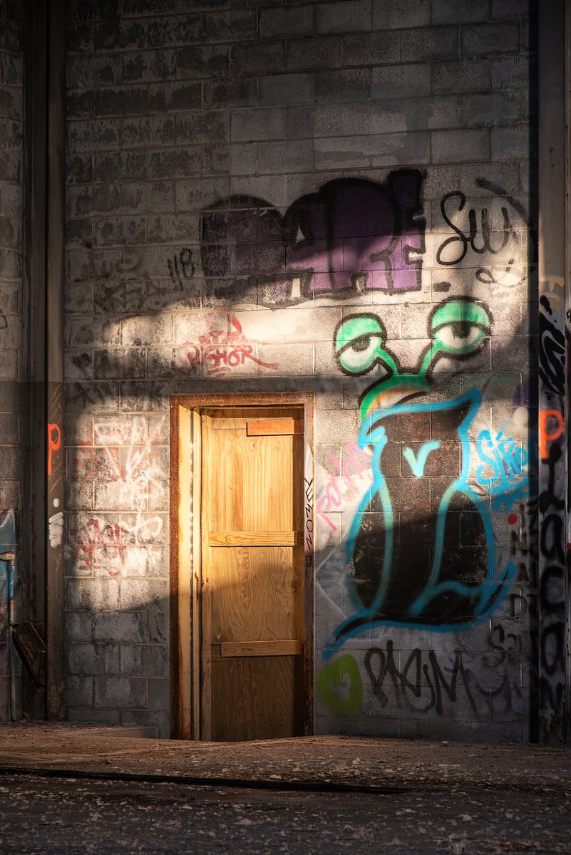 ExploresMr's tweet image. Light and shadow at golden hour; inside a former and abandoned city maintenance garage in Detroit, Michigan.