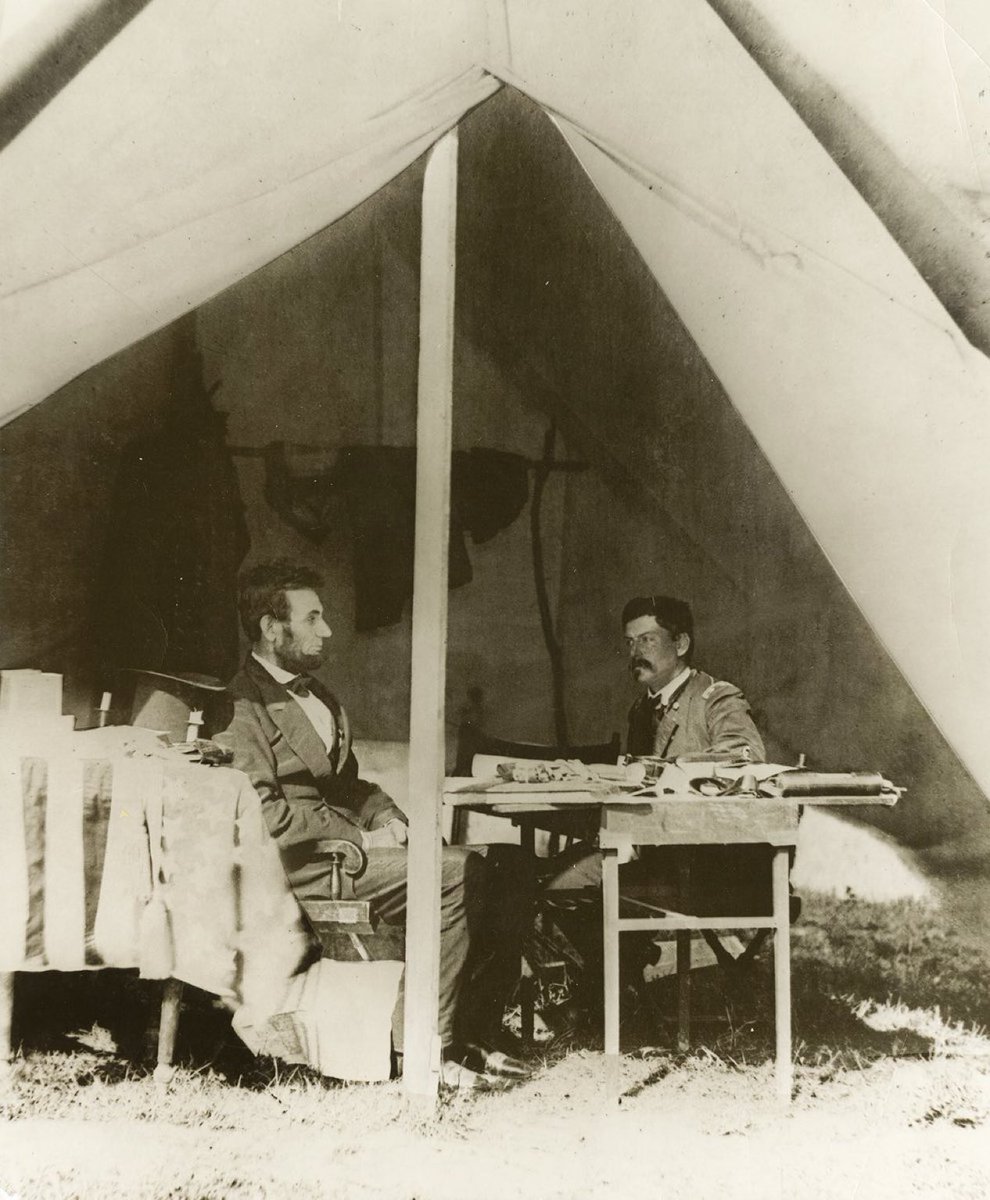 historycalendar's tweet image. President Abraham Lincoln and General George McClellan confer in the general's headquarters tent at Antietam, 1862.