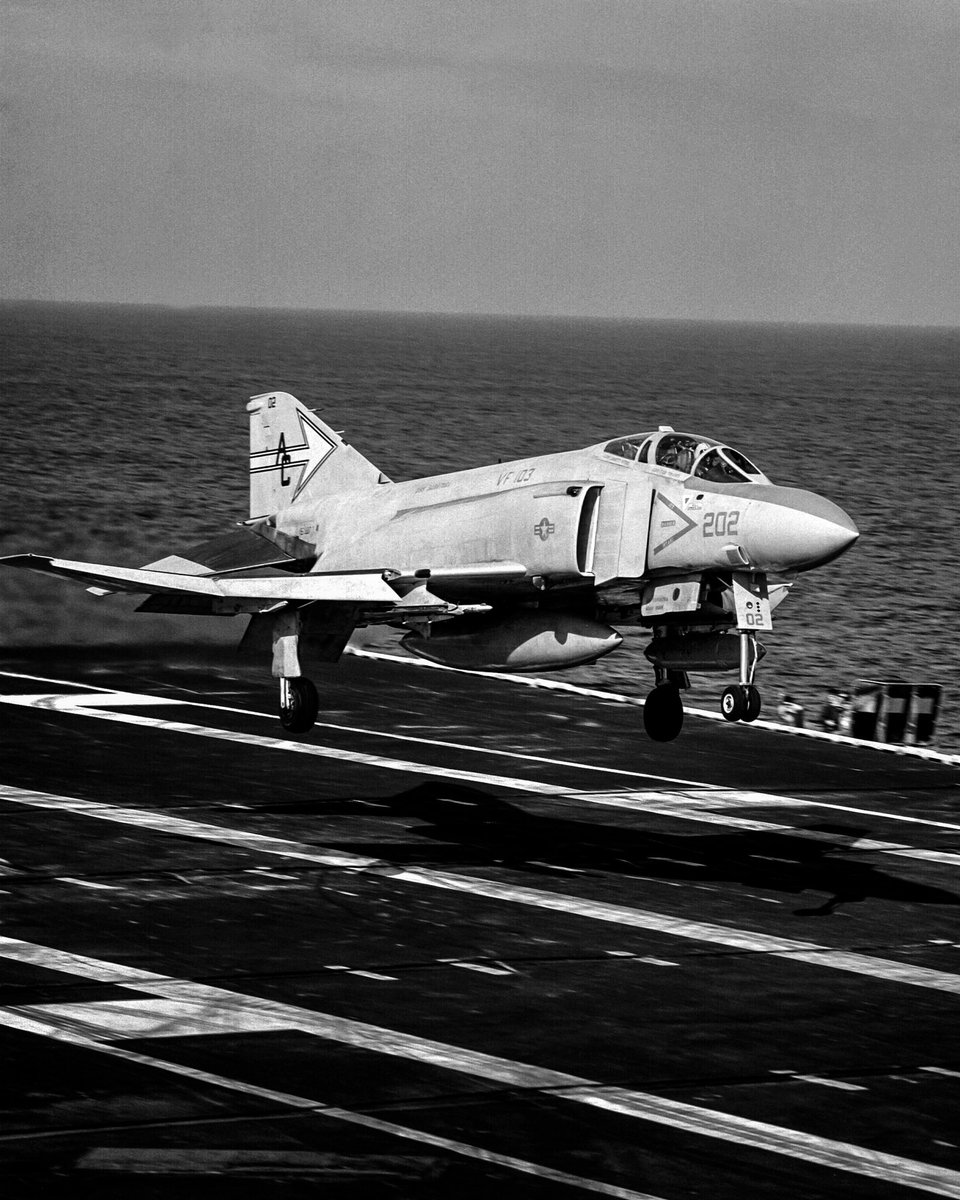kadonkey's tweet image. A U.S. Navy McDonnell Douglas F-4J Phantom II assigned to the SLUGGERS of VF-103 landing on the USS Saratoga 8JAN80 (Robert L. Lawson)