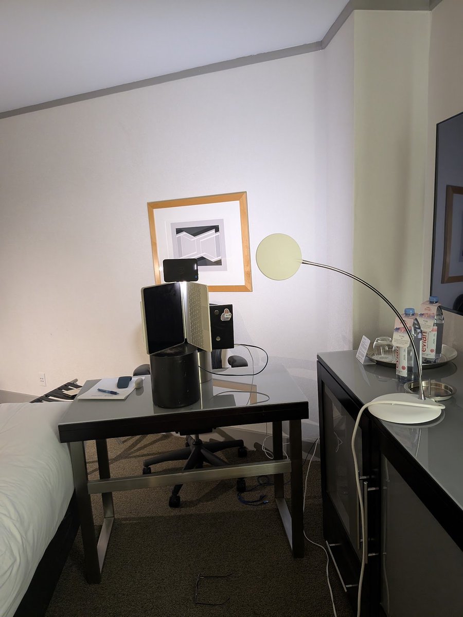 JustinWolfers's tweet image. About to get inside your teevee with the wonderful @SRuhle and here's what you won't see: Macguyvering my hotel room to serve as an on-the-road studio.
That's a laptop perched on an ice bucket, with an ipad on a trash can balancing my portable light.