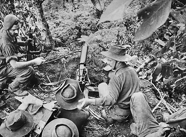 DWB55's tweet image. July 1943
Lt H. Egan, of the Australian 2/3rd Commandos, is at left with a pipe and holding his Thompson SMG.
He was killed in action a few days later on 21/7/43.
They are manning a Vickers MG in a jungle gunpit on a humid hotly contested ridgetop near Salamaua, New Guinea coast.
