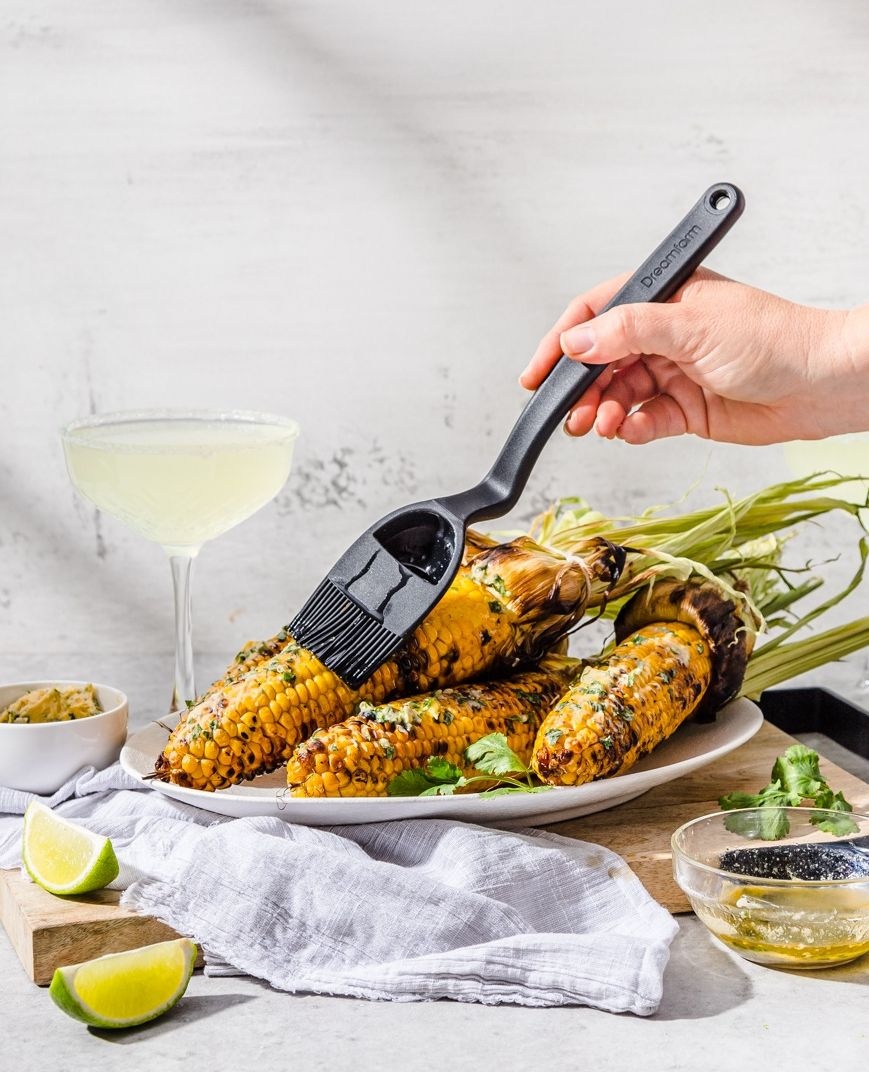 It's corn! 🌽 A big lump with knobs. It has the juice... 🎵

Brizzle is a silicone basting brush that bends to scoop, drizzles to baste, and sits up. Brizzle is perfect for drizzling oil, basting pan juices, and of course brushing corn with butter. 🧈

☞ dreamfarm.com