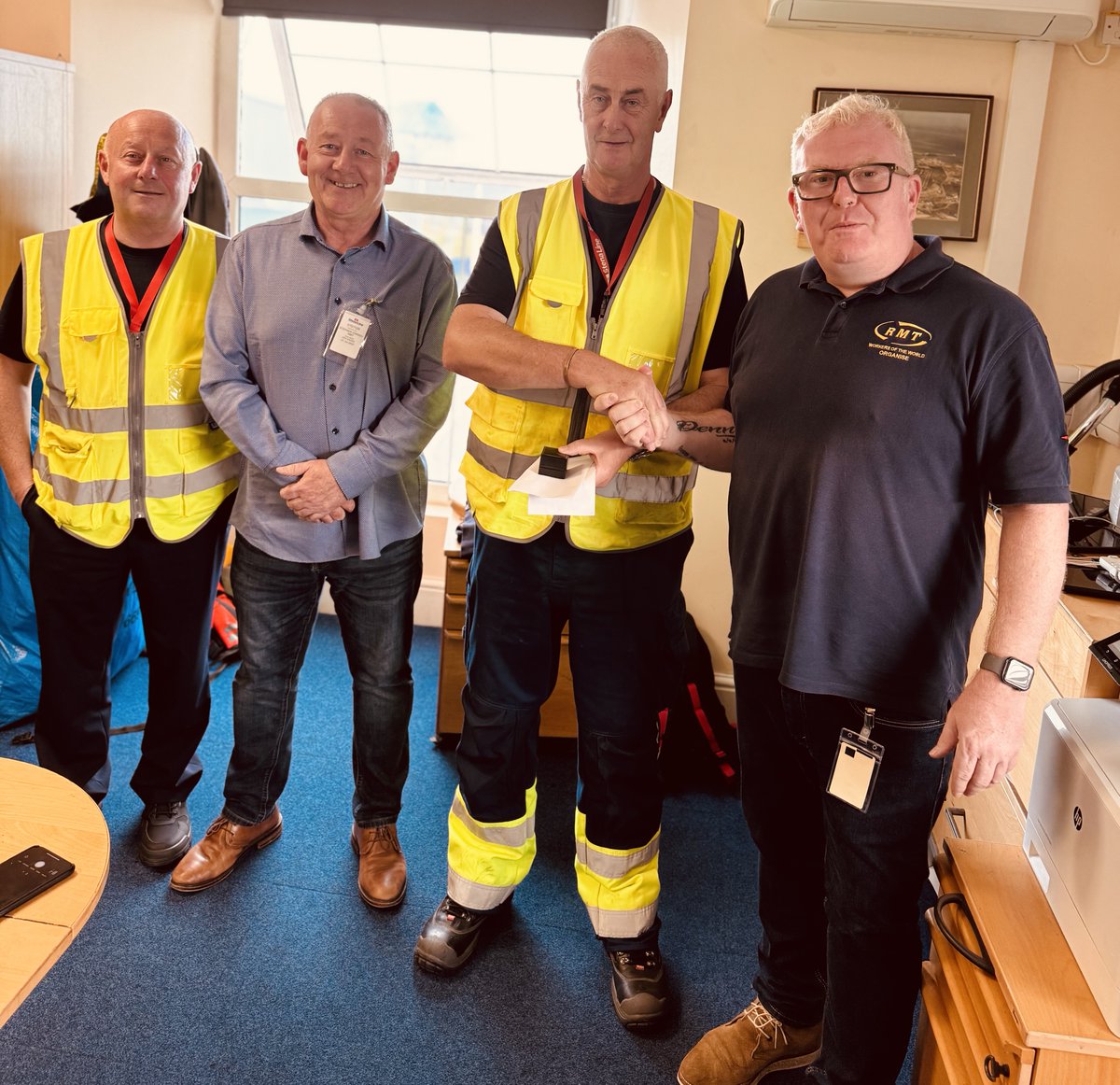 RMTunion's tweet image. 🥳 50 years a member!
RMT National Secretary, @dazprocter, and Holyhead No1 branch Secretary and NEC member, Steve Conway, hand over a medal to commemorate 50 years of membership to Stena Line port worker, Hywel Gray.
RMT - never leave home without us.
