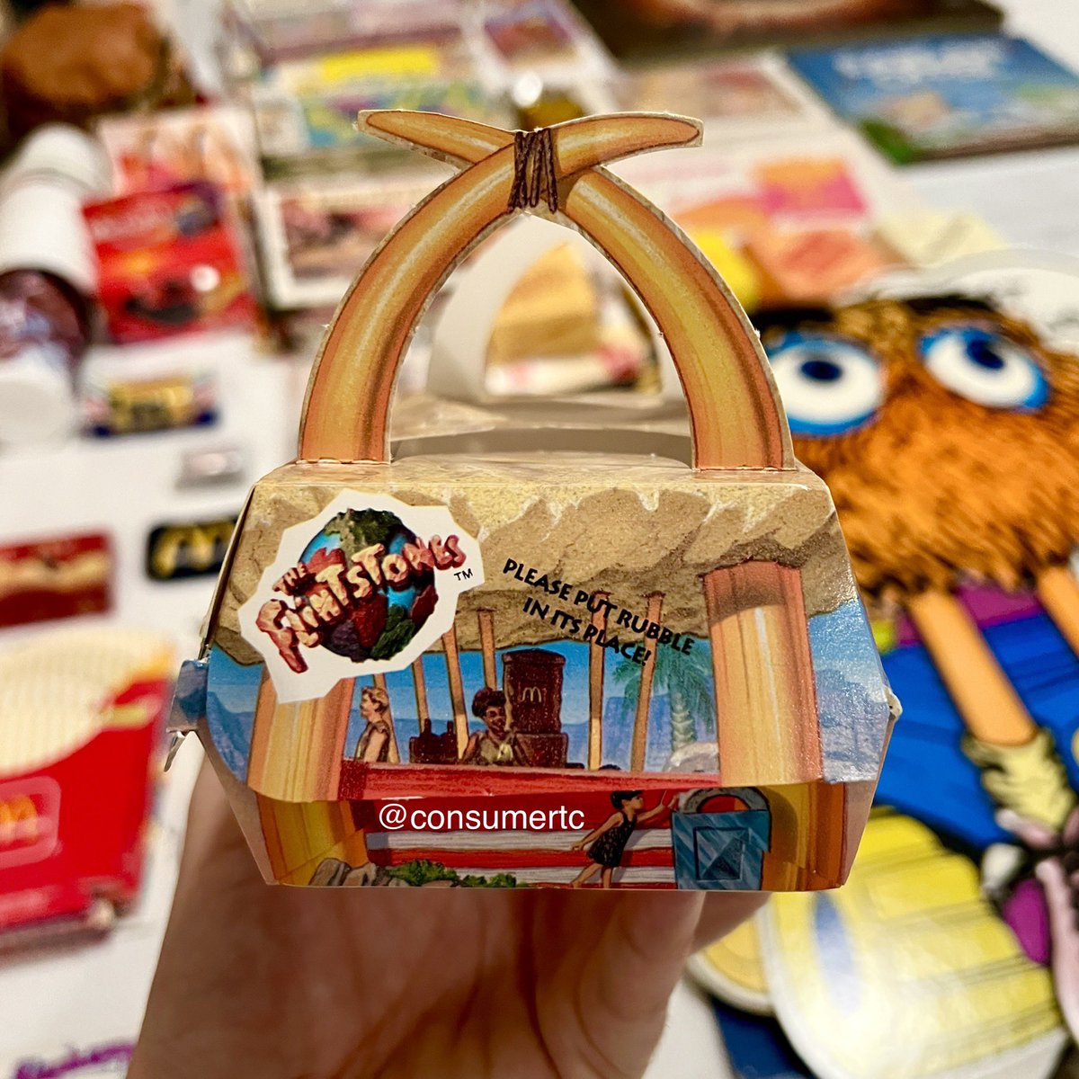 consumertc's tweet image. The 1994 McRib box from the Flintstones-inspired RocDonald’s Grand Poobah meal... packaging design doesn't get much sweeter than this!