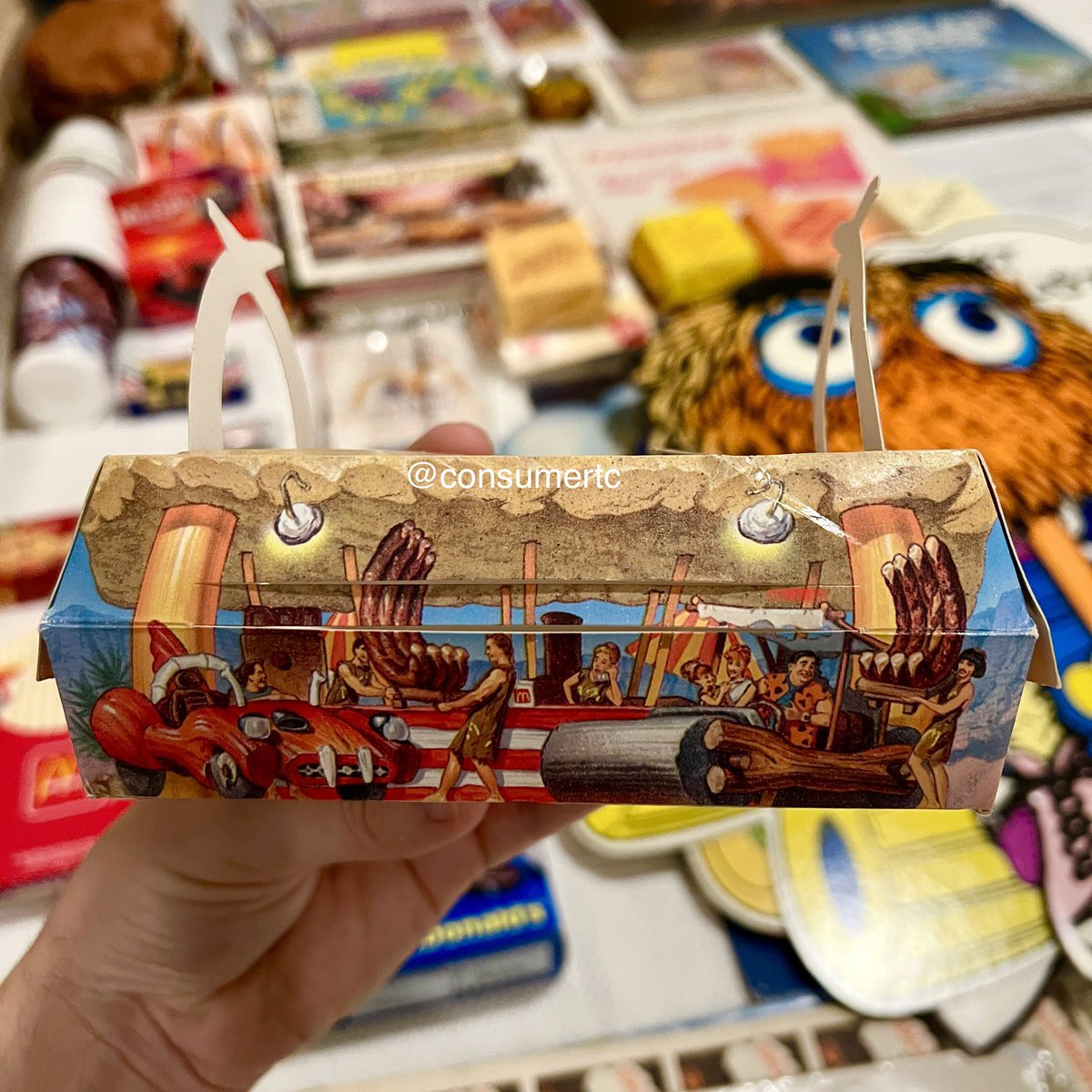 consumertc's tweet image. The 1994 McRib box from the Flintstones-inspired RocDonald’s Grand Poobah meal... packaging design doesn't get much sweeter than this!