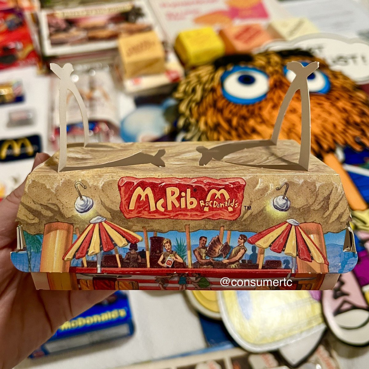 consumertc's tweet image. The 1994 McRib box from the Flintstones-inspired RocDonald’s Grand Poobah meal... packaging design doesn't get much sweeter than this!