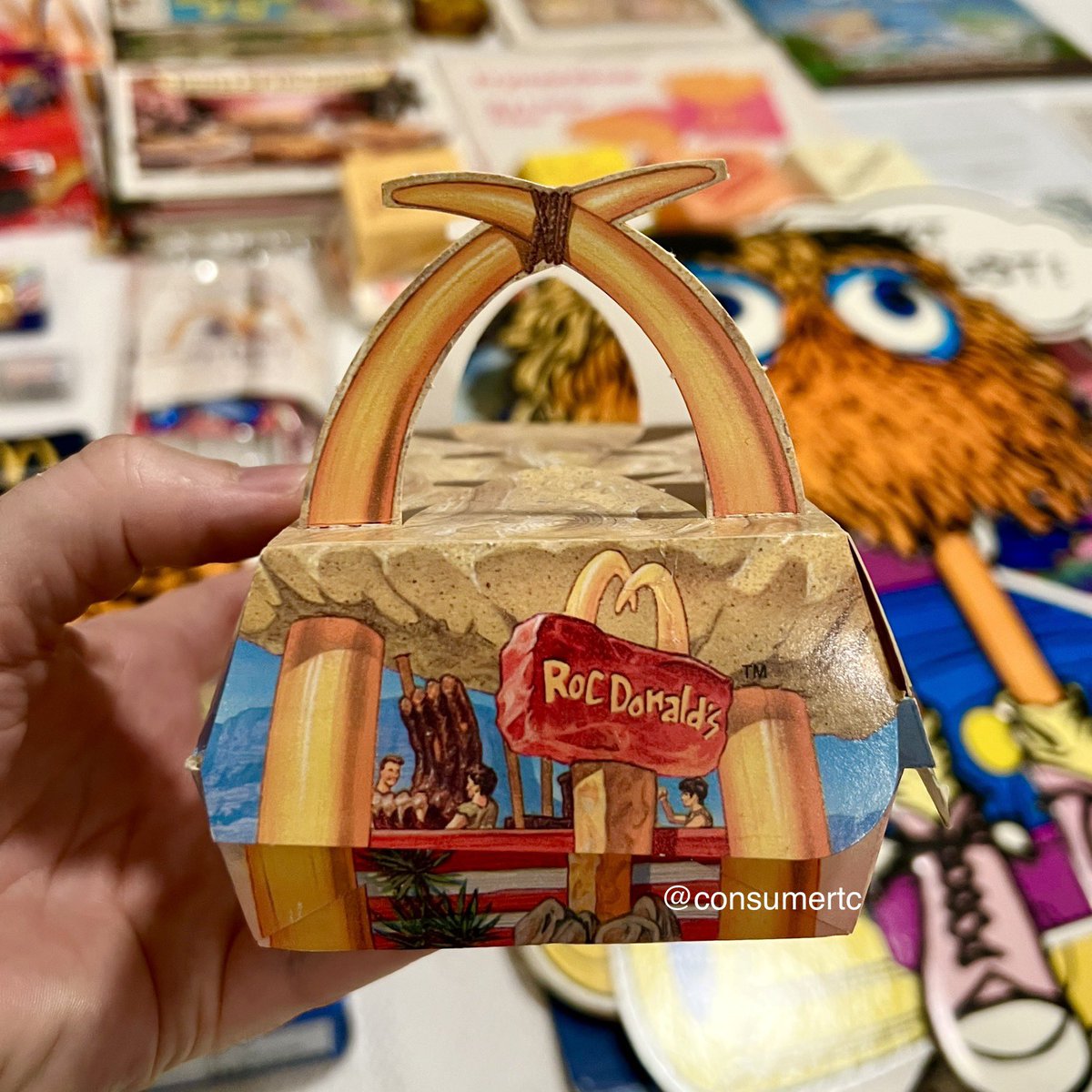 consumertc's tweet image. The 1994 McRib box from the Flintstones-inspired RocDonald’s Grand Poobah meal... packaging design doesn't get much sweeter than this!