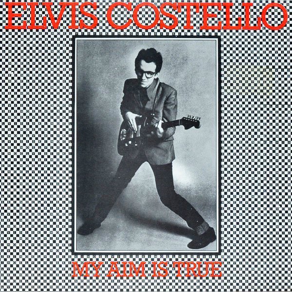 JakeRudh's tweet image. On this day in 1977, Elvis Costello released his debut studio album “My Aim Is True” featuring singles "Less Than Zero" "Alison" and “The Angels Wanna Wear My) Red Shoes"