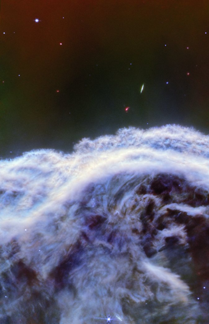 SpaceTelescope's tweet image. This dreamy, foam-like scene is a portion of the Horsehead Nebula imaged by #NASAWebb in 2023. Webb shows some of the “mane,” which is composed of dusty silicates and soot-like molecules, in great detail: bit.ly/3HBSwBM