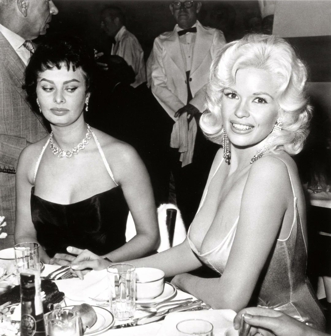 <a href="/historyinmemes/">Historic Vids</a> Sophia Loren and Jayne Mansfield at a 20th Century Fox party thrown in Sophia Loren's honor April 12th, 1957