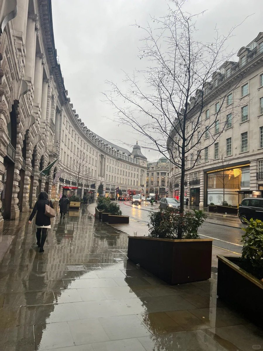 Embracing the gentle embrace of London's light rain, a serene melody for the soul.