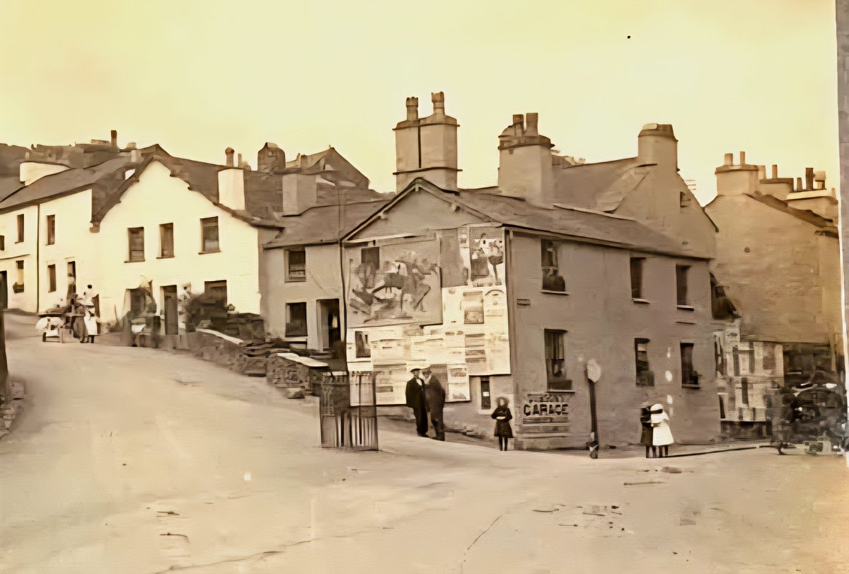 thelonningsguy's tweet image. Ambleside's iconic postbox (hideously blocked by signposts 😡) - and how it looked in the 1920s complete with the optimistic planting of a tree on the roundabout. #Cumbria