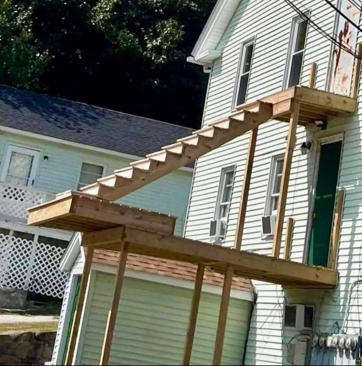 live_free_603's tweet image. Inspector says we need egress stairs for the top unit for fire exit.
I say fine, build stairs.
Inspector comes back, says stairs not good enough. “How do they get down in a fire?”
I says: “10 ft jump better than roasting!”
It’s impossible to make these people happy.