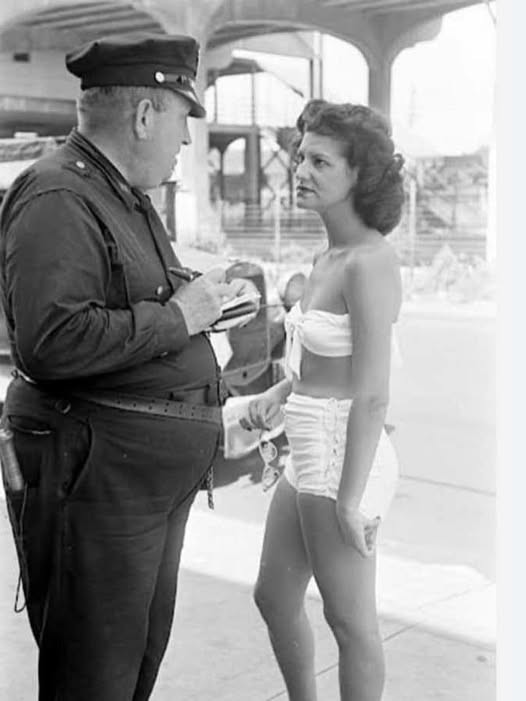 JamesTate121's tweet image. Being ticketed for indecent exposure at Rockaway Beach (New York City), 1946.
In my humble opinion, the bathing suit looks very decent and her hairdo looks fabulous. I also like her scowl.