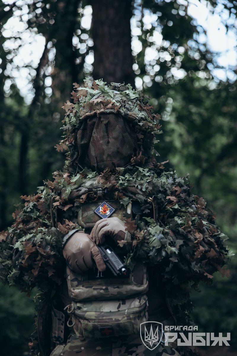 AlexRubizh's tweet image. An Invisible Threat: Sappers of Brigade "Rubizh" in Their Camouflage
Stealth in Action
Amidst the dense summer foliage, the support battalion fighters of Brigade "Rubizh" face the challenge of staying completely undetected. Most of their critical tasks take place right at the…