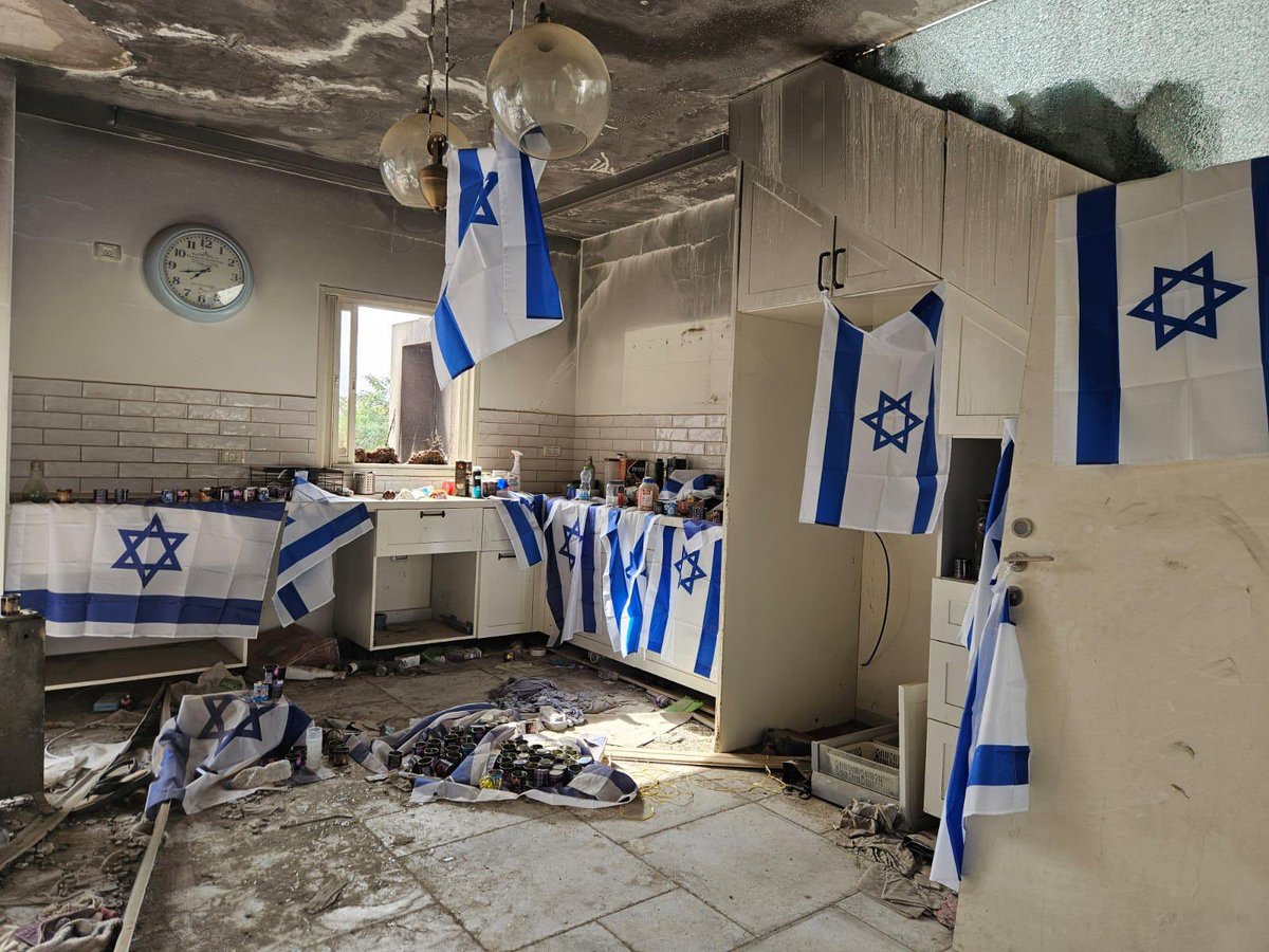 Israel's tweet image. Kibbutz Be’eri, months after October 7.
The kitchen is charred, the windows shattered, but Israeli flags cover every surface.
In the face of adversity, this is our answer: rebuilding, remembrance, and unshakable resilience.
50 hostages are still in Gaza. Their absence is felt…