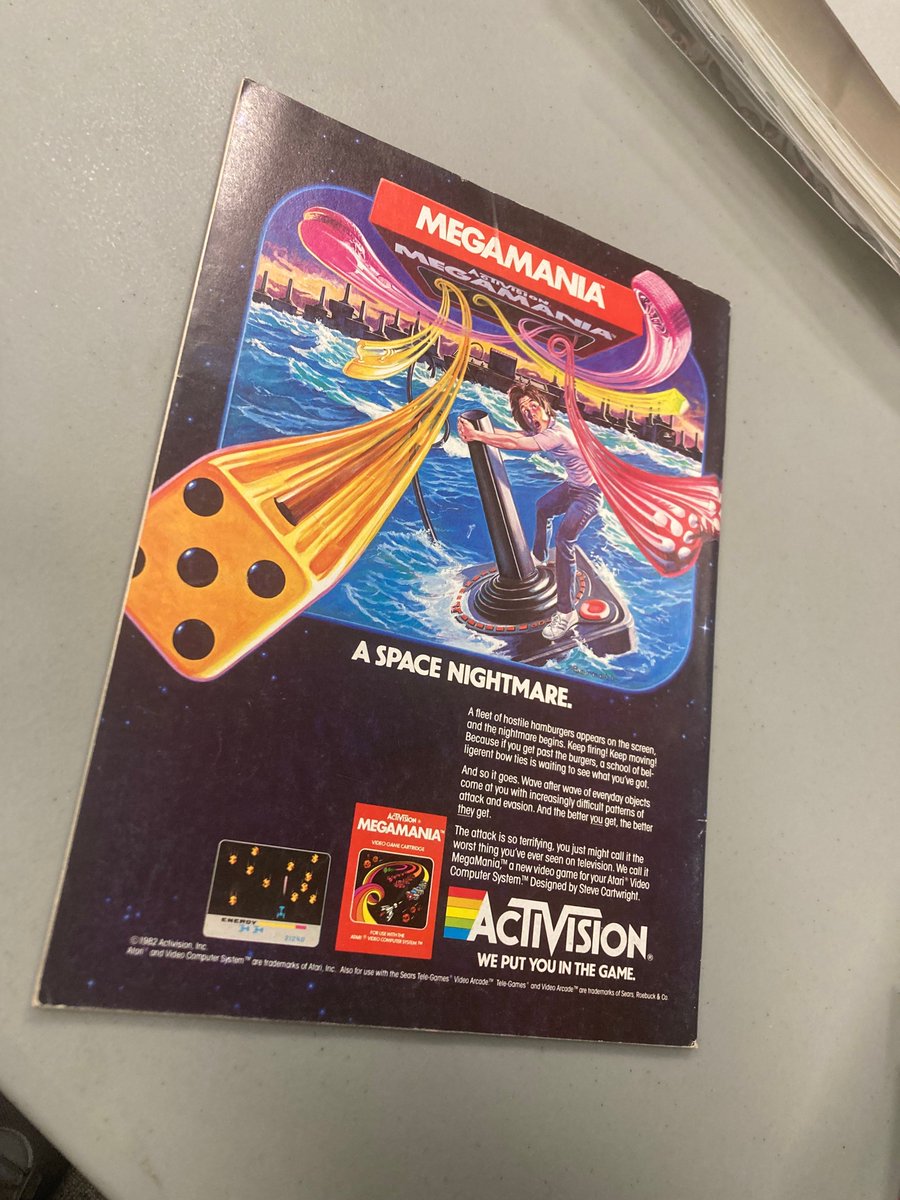 GameHistoryOrg's tweet image. Adrift at sea with only an Atari joystick for company? This surreal VGHF Library print ad - for Activision&apos;s 1982 Astro Blaster-esque shooter Megamania for the Atari 2600 - suggests just such a thing...