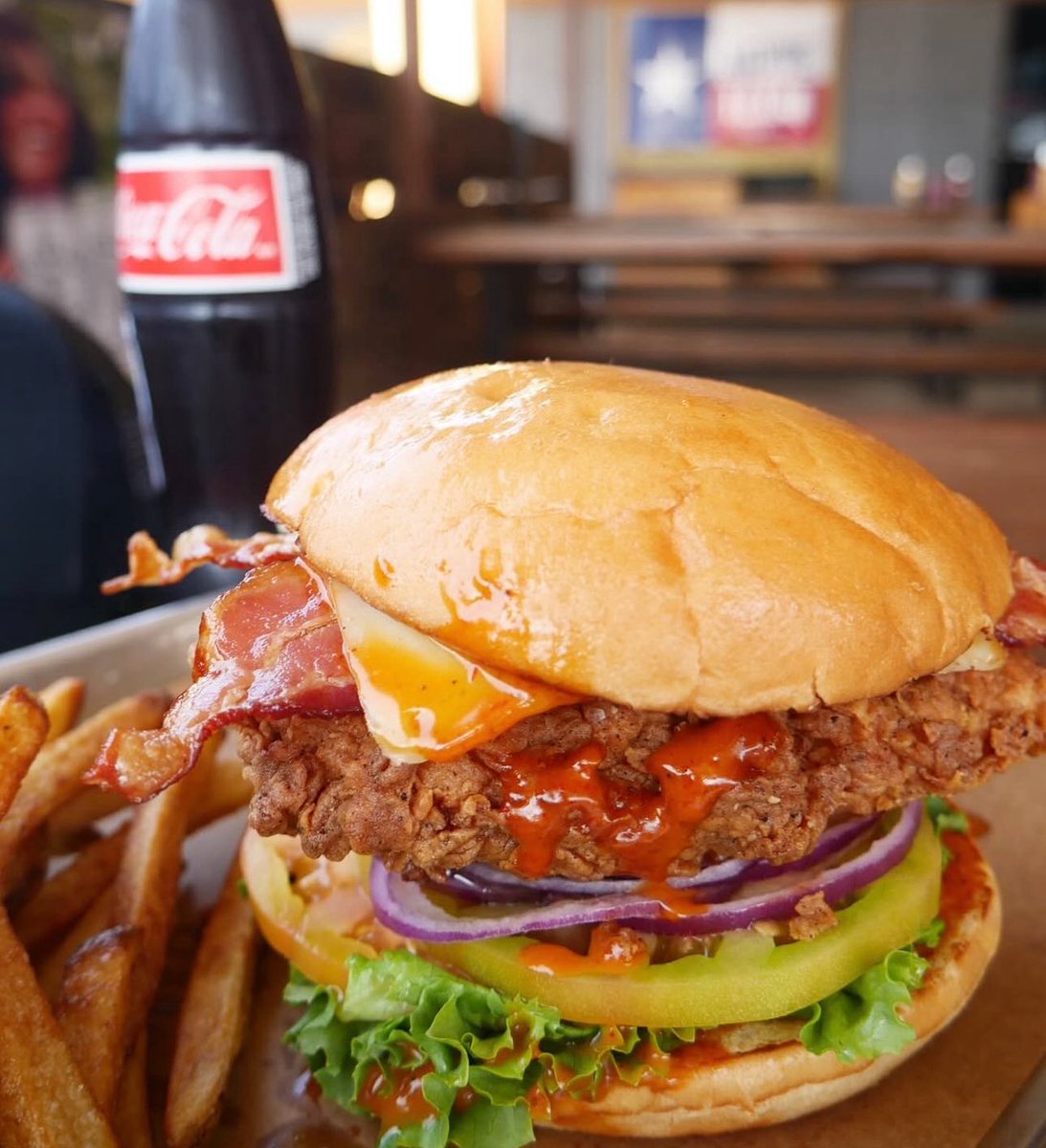 #Tuesday 💥 The Stiles Switch Deluxe Chicken Sandwich - 💥 fried chicken sandwich dressed w heirloom tomatoes, Honey Chipotle Vinaigrette, Swiss Cheese, Bacon, lettuce, &amp; red onion. Served w a side of hand-cut homemade French Fries.
#TexasBBQ #BBQ  #ATX #AustinTexas #Barbecue