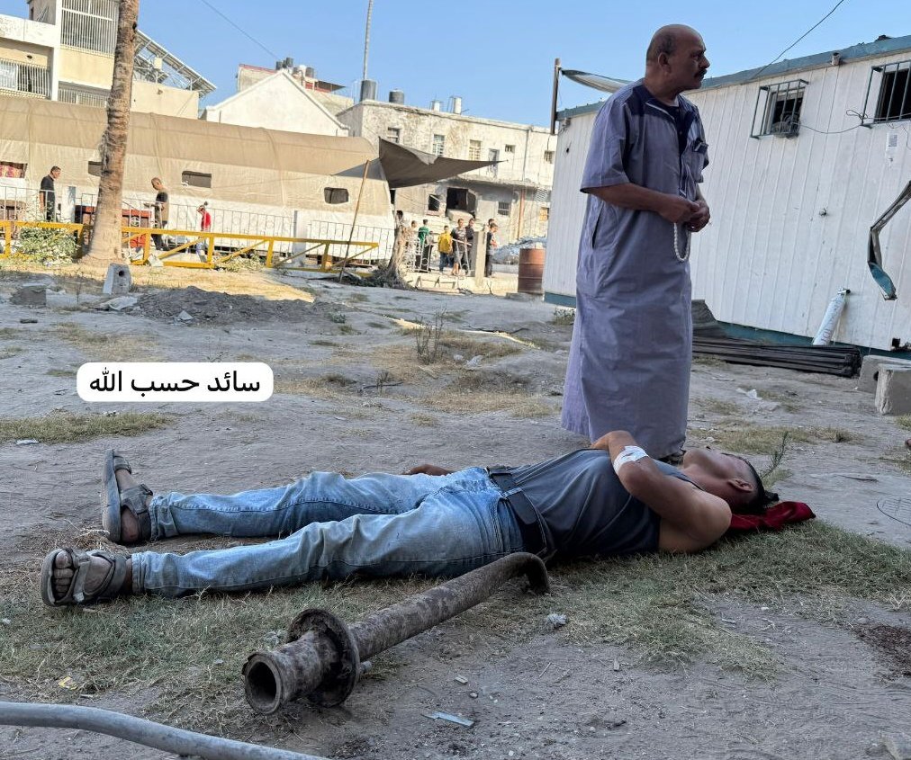 PalPress24's tweet image. A wounded Palestinian young man lies on the ground after the emergency room at Al-Ahli Baptist Hospital in Gaza City became full of martyrs and injured people.