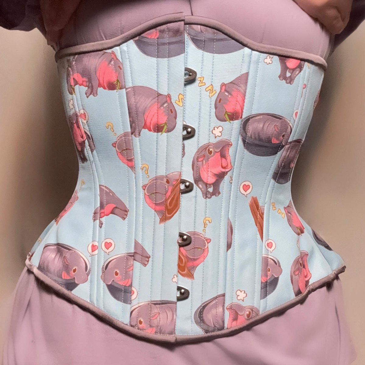 Cute overload activated! 💥🦛
This pastel corset is bursting with happy hippos—yawning, munching, and melting hearts 💘✨
A perfect mix of whimsy and wow. Too cute to handle. 

#CuteOverload #HappyHippos #TimelessTrends #CorsetCrush #WhimsicalStyle