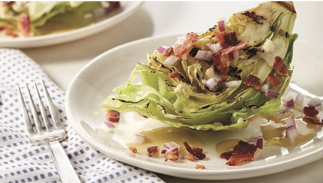 Looking for a different side for your summer cookout? Try this spin on the traditional wedge salad, featuring grilled lettuce topped with garlic tahini dressing, bacon and onions: rebrand.ly/dz25vcd #eatright #eatrightPRO #eatrightAMBASSADOR