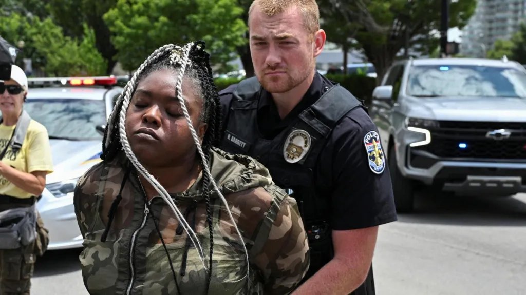 CathyReisenwitz's tweet image. Bianca Austin, Breonna Taylor's aunt, being arrested outside the courthouse while protesting
Former Kentucky cop Brett Hankison will serve 33 months after firing 10 times blindly into her apartment. He and two other cops shot her to death while she slept.