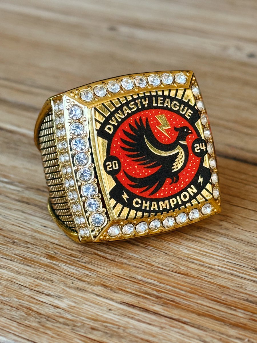 TadCarpenter's tweet image. You might not know this but I love Fantasy Football. Been playing for 20+ w/ same buds. I won our Dynasty League last year taking home the RING. Instead of 1 of my non-design buds designing it (PUKE), they surprised me having my designer wife Jessica design it. Look at this baby!