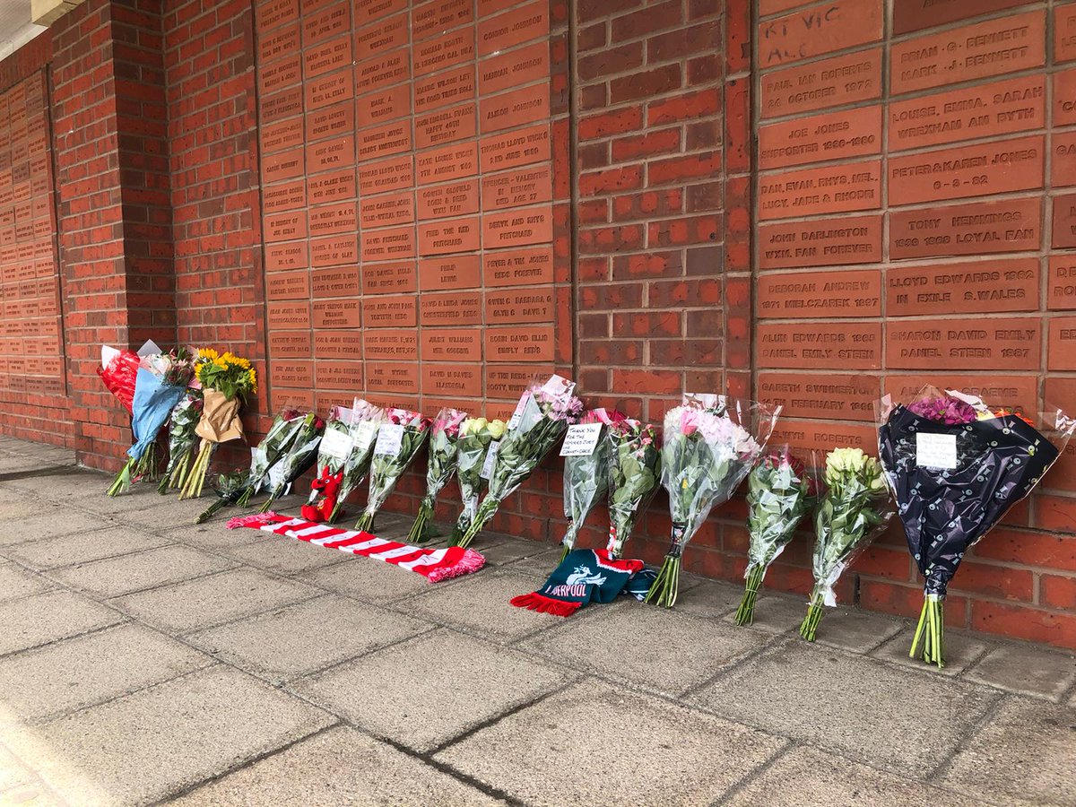 LBCNewsWales's tweet image. People have been leaving tributes at Wrexham's Racecourse Ground, following the death of Joey Jones.
The former Wales international - who was 70 - started and ended his career at the club.