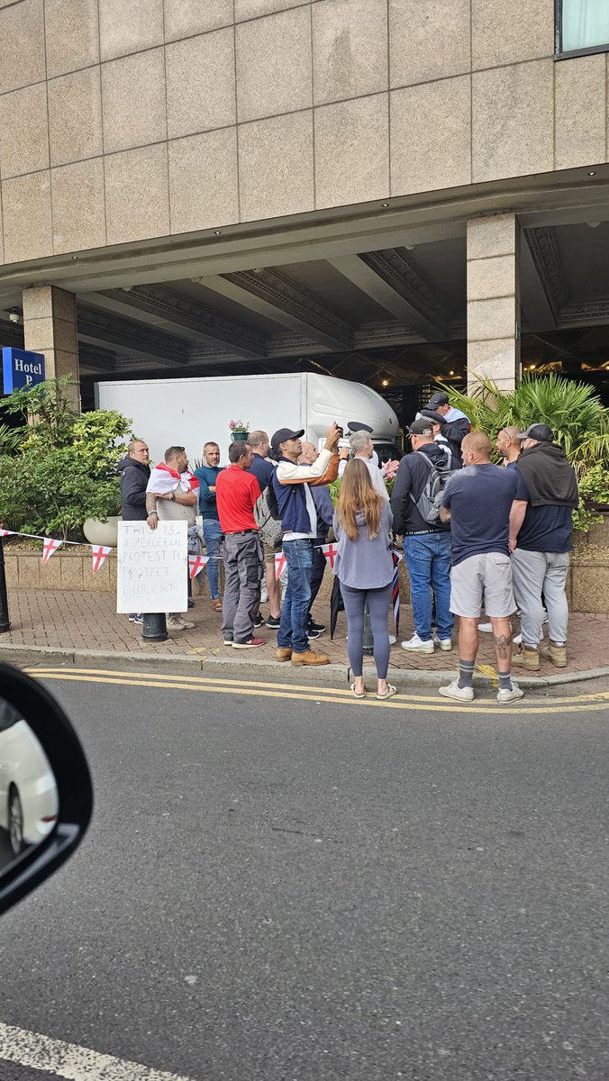 CrimeLdn's tweet image. A small protest outside the britannia Hotel Carnary Wharf