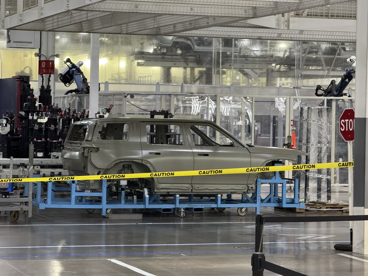 Hilbe's tweet image. By request, here are all my pictures of the Rivian R2 body on white from the factory. See anything interesting?