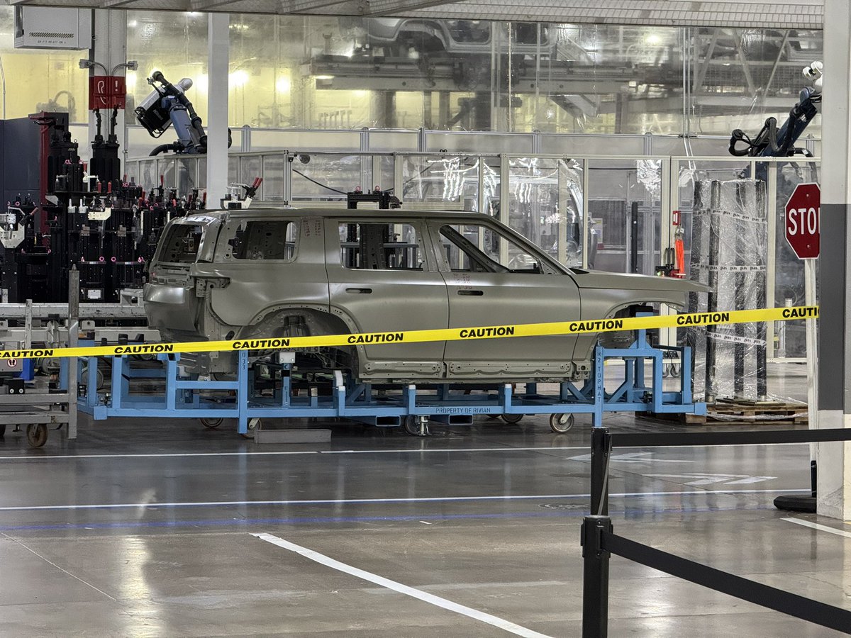 Hilbe's tweet image. By request, here are all my pictures of the Rivian R2 body on white from the factory. See anything interesting?