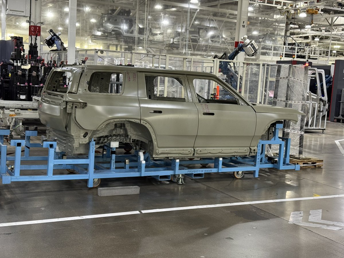 Hilbe's tweet image. By request, here are all my pictures of the Rivian R2 body on white from the factory. See anything interesting?