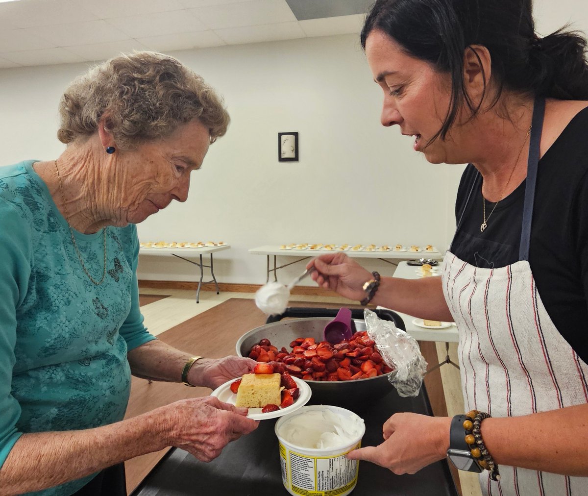 Wellington County chicken farmer Kelly Hiddema serves strawberries to Helen Moffat at the Drayton United Church Strawberry Social and Cold Plate supper. More than 300 people attended this event held at the Drayton Arena.

📸: Sharon Grose