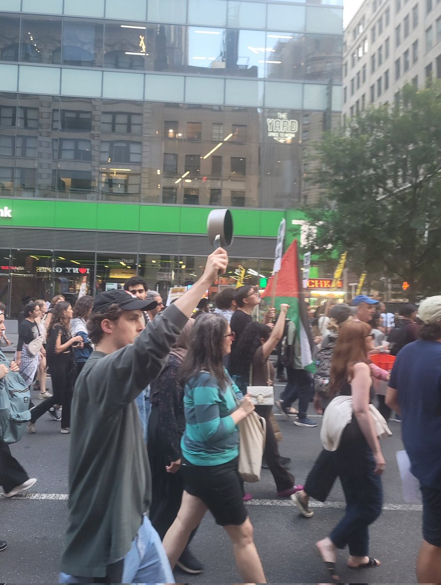 patrickdehahn's tweet image. A protester holds up an empty pot at a march calling for the lift of Israel's siege on Gaza in New York's Manhattan.
Palestinians, humanitarians, and doctors have reported a rise in hunger cases in Gaza after Israel's limits on food aid.