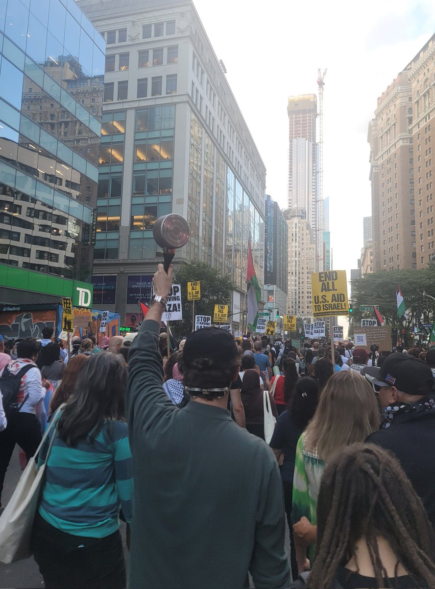 patrickdehahn's tweet image. A protester holds up an empty pot at a march calling for the lift of Israel's siege on Gaza in New York's Manhattan.
Palestinians, humanitarians, and doctors have reported a rise in hunger cases in Gaza after Israel's limits on food aid.