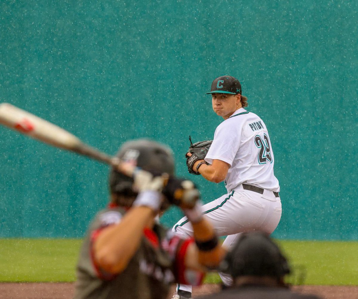 Ripat53's tweet image. This looks like a bad picture of Matt Potok, but if you look closer he was actually pitching in pouring rain