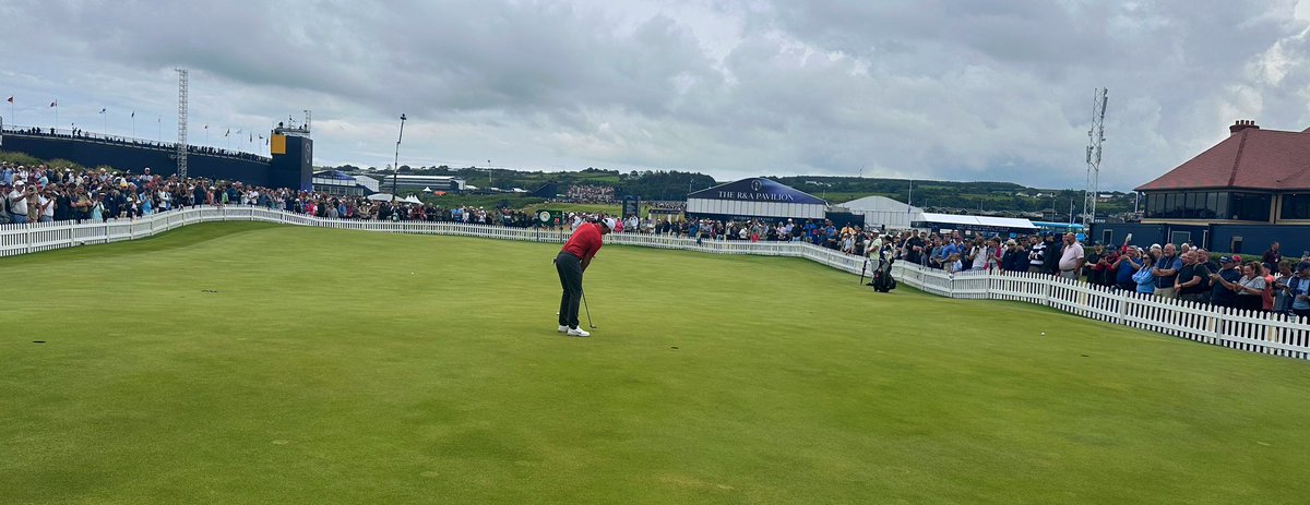 eamonlynch's tweet image. Rory McIlroy, solo on the putting green at Royal Portrush before the third round of the Open, watched intently by a large crowd.