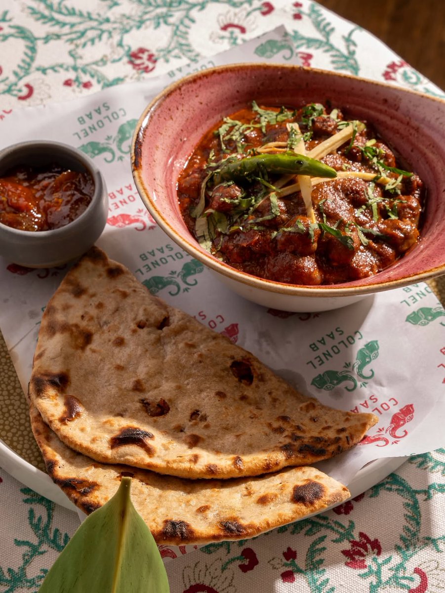 A classic straight from the streets of Amritsar, Chole Kuclhe. Tender onion-stuffed kulchas meet boldly spiced chana masala. Served with chilli and lime pickle for that punch of heat. Simple, soulful, and unapologetically delicious.
-
For reservations:
colonelsaab.co.uk
-
