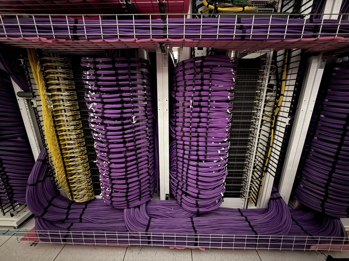 almc_d's tweet image. So what are these beautifully crafted cabling and network switch racks Elon posted from @xai’s latest DC Colossus2?
They are a small part of a new DC Core network CLOS fabric the infra teams designed, developed and built in mere weeks.