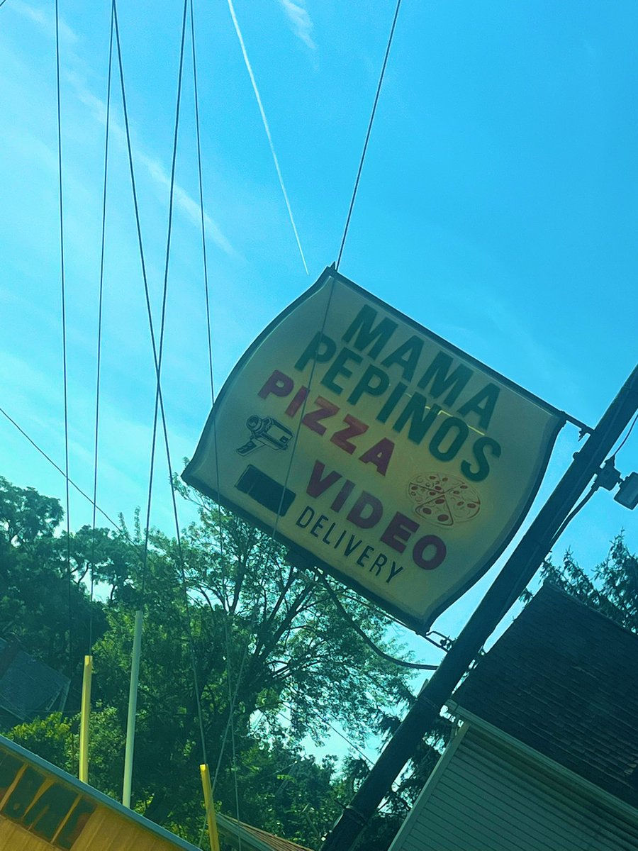 alonna_lee's tweet image. Found this place in my travels and literally stopped to get a pic. While it would appear the “video delivery” part is extinct, the pizza shop is still open. Imagine ordering pizza and a VHS tape on a Friday night. Peak society.