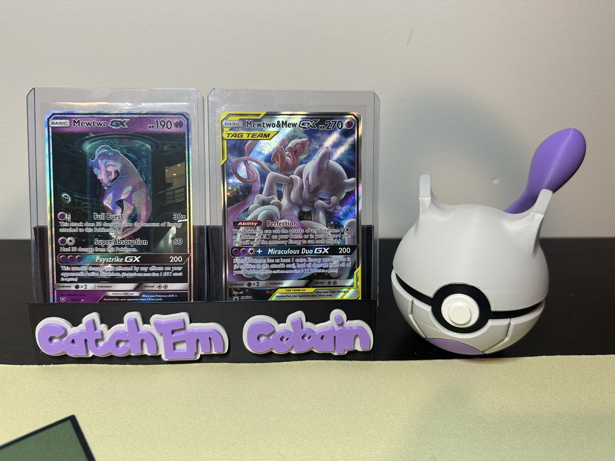 CatchEmCobain's tweet photo. Huge shout out to my guy @PokeTeeJay for hooking me up with this custom card stand and Mewtwo Pokeball! Excited to be able to display my favorite cards in style #pokemon #pokémontcg #pokemoncardcollection #pokemoncards #pokemoncommunity #mewtwo #3dprints https://t.co/JHhrcPUsap