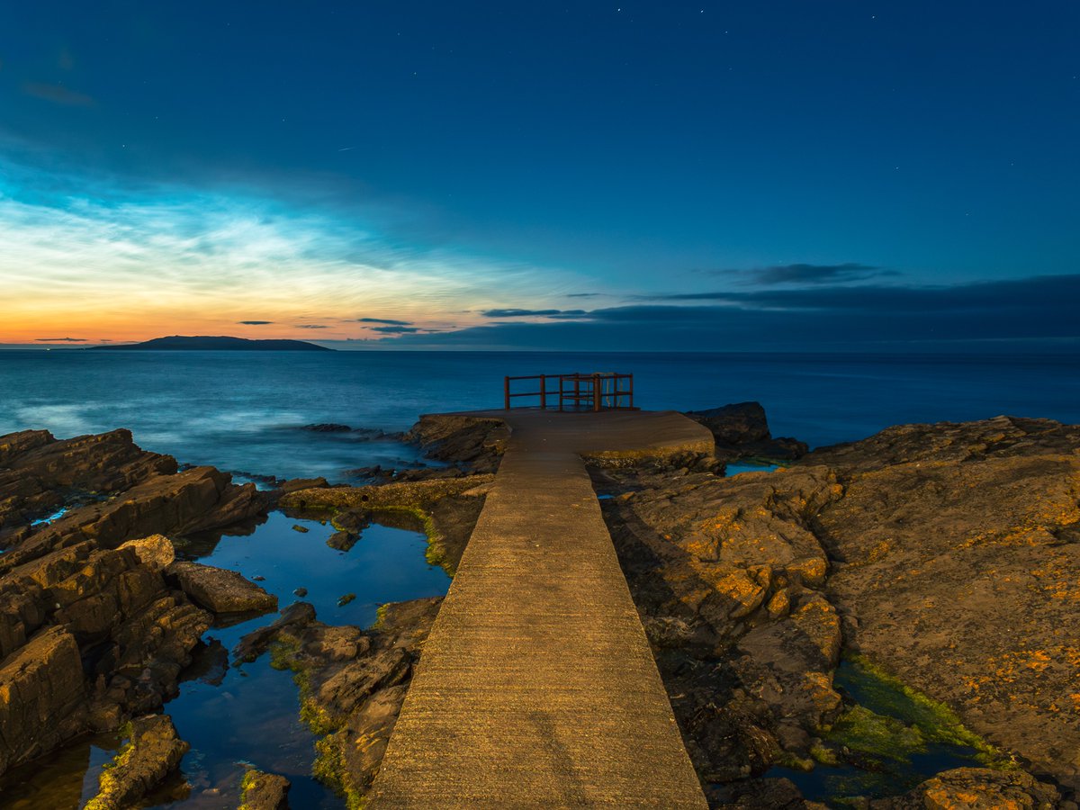 sryanbruenphoto's tweet image. A classic High Rock view but with a twist with noctilucent clouds to the northeast from the morning of 30th June 2025. Second photo is the same composition but during a fiery sunrise in August 2021.