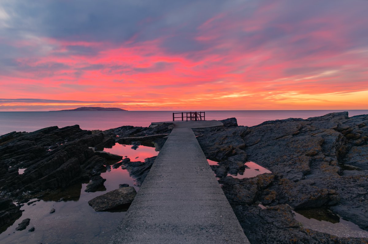 sryanbruenphoto's tweet image. A classic High Rock view but with a twist with noctilucent clouds to the northeast from the morning of 30th June 2025. Second photo is the same composition but during a fiery sunrise in August 2021.