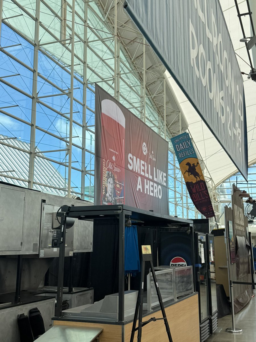ParksAndCons's tweet image. Old Spice #Superman banner in Sails. This push is reminiscent of the Moss Man deodorants given away at the Mattel booth more than a decade ago #SDCC