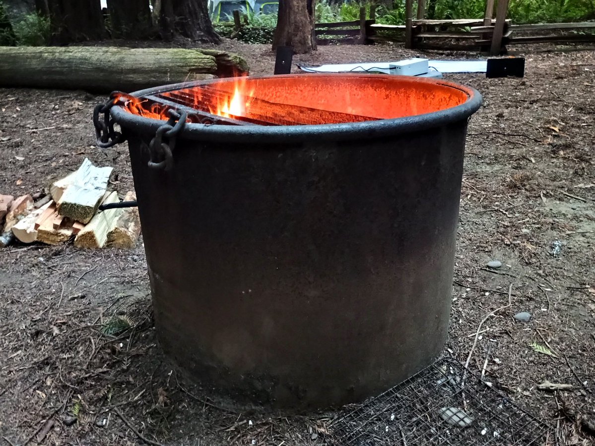 DrInsensitive's tweet image. This is the government approved fire pit in a government campground.
Designed by people who don't know, or don't care what a campfire is for.
Sitting around this "fire pit" you can't see the fire.
But it makes the girls feel safe.