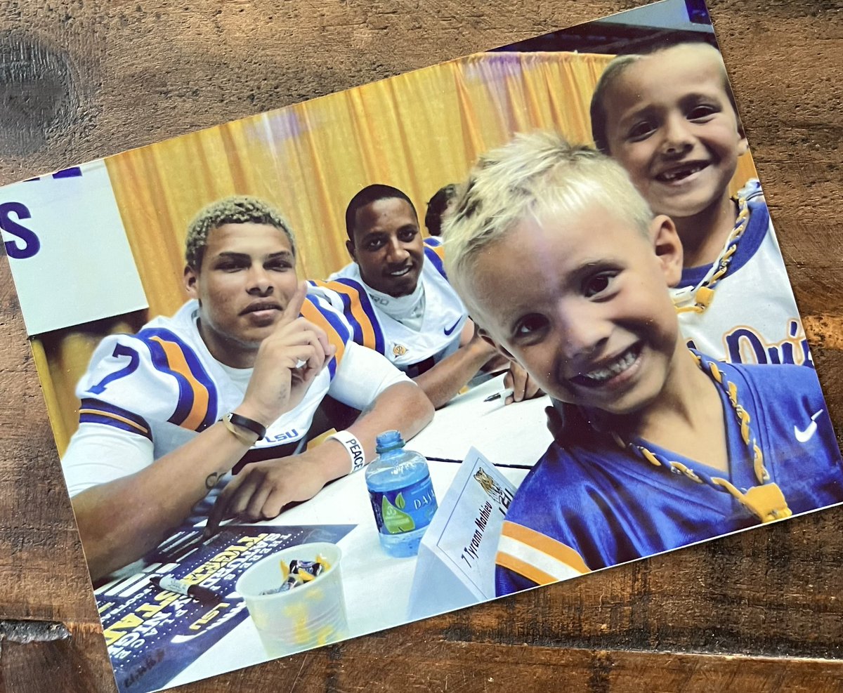 vintagelsuftb's tweet image. Hats off to a phenomenal career @Mathieu_Era. Maybe the most electrifying player in LSU history. Here’s a picture he took with my 2 boys at the 2011 LSU Fan Day. Class act.