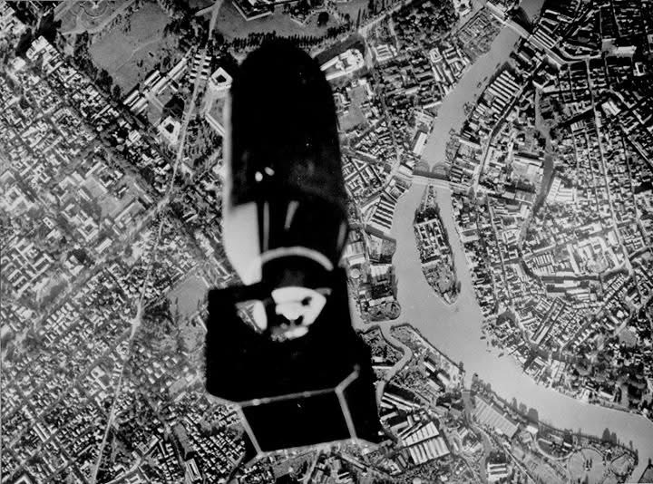 VoicesofWW2's tweet image. Bomb bay camera in a TBF-1 Avenger from USS Essex captures the moment of bomb release over the Pasig River in downtown Manila, Luzon, Philippines, 14 November 1944