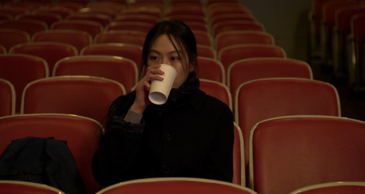 kim minhee in a movie theatre in a hang sang soo movie